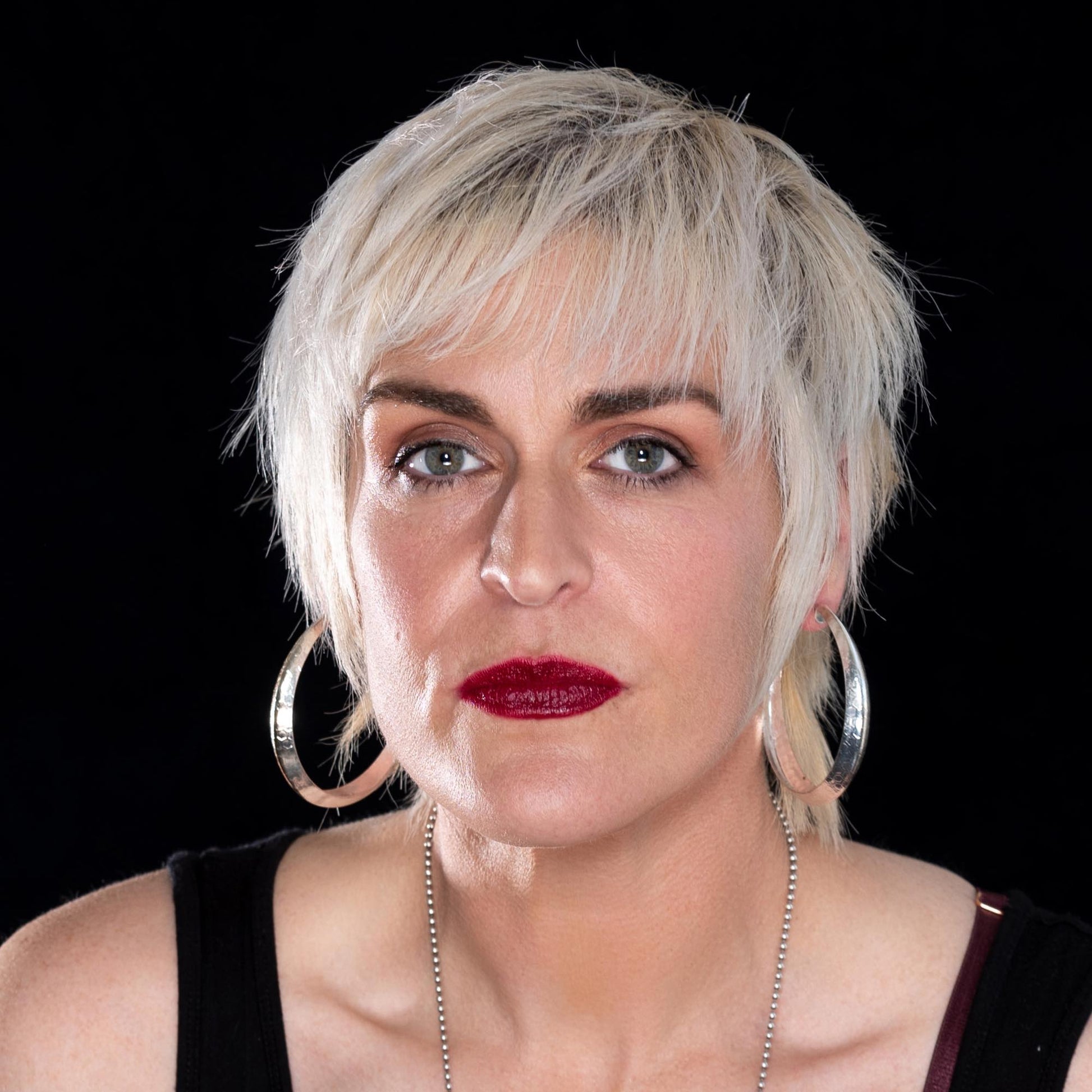 blond wearing Emanare - Bold Dark Berry Plumb Red Organic Lipstick
