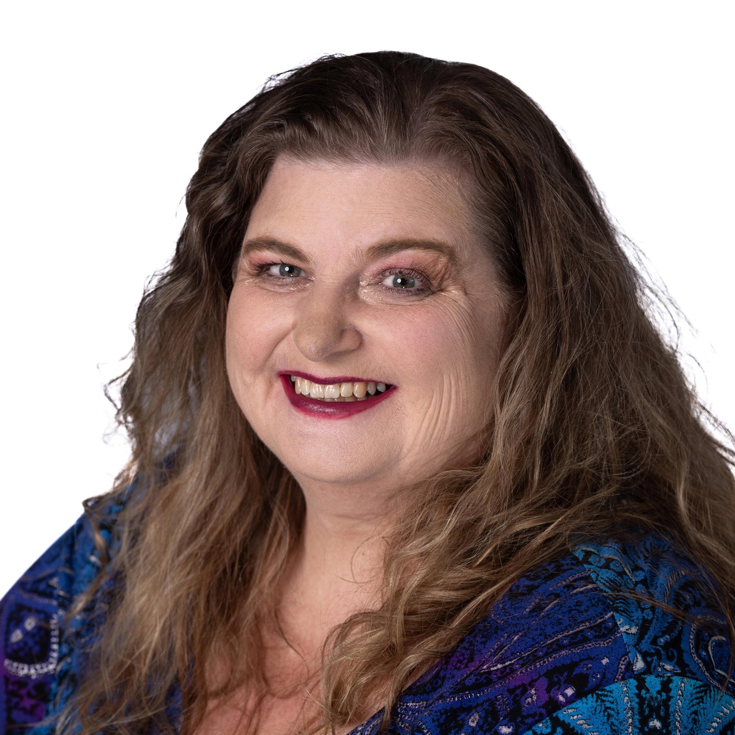 brunette on white background wearing rhumba purple plumb lipstick and magnetic foundation.