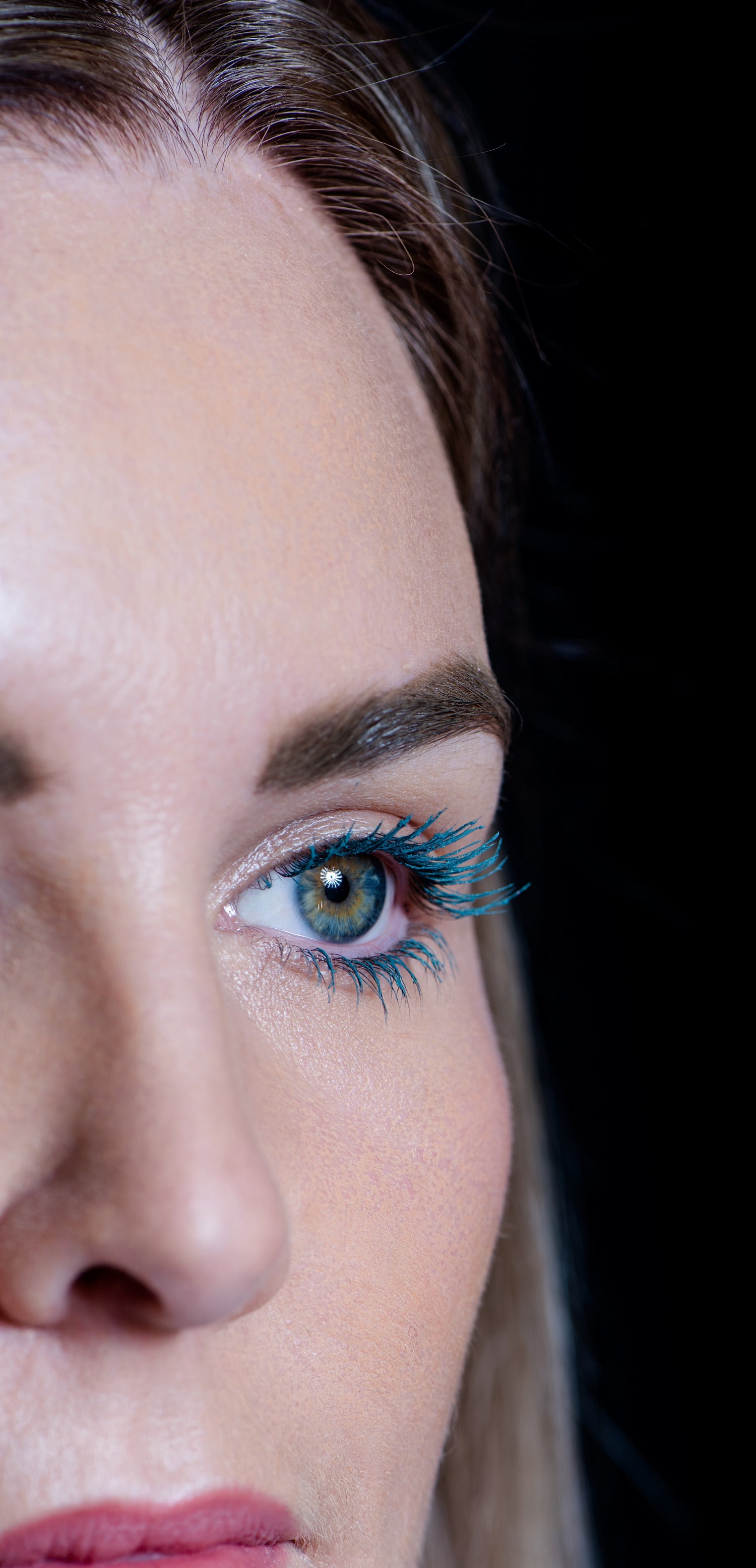 Nereis- Teal/sage green mascara on caucasian woman