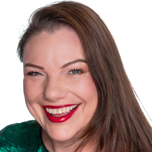 brunette on white back ground wearing tango- rich berry pink lipstick, pink undertone pale foundation, berry pink resilience blush
