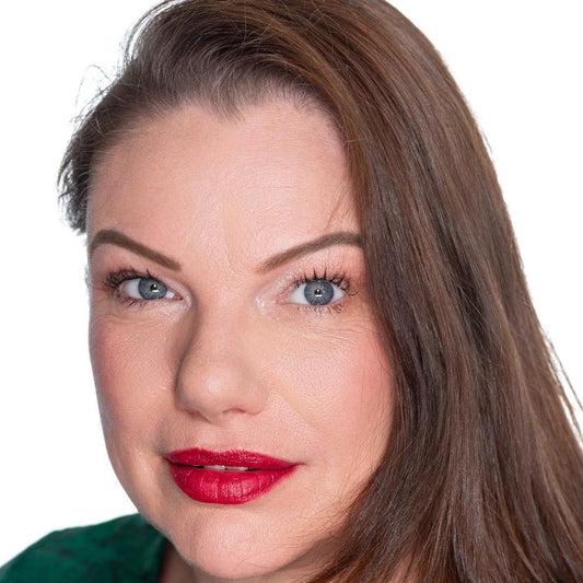 brunette on white back ground wearing tango rich berry pick lipstick, ravishing foundation , brown eyebrow pomade and black mascara