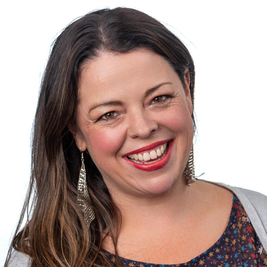 brunette on white back ground wearing berry kissable lipstick